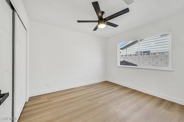 unfurnished bedroom with ceiling fan, a closet, and light wood-type flooring