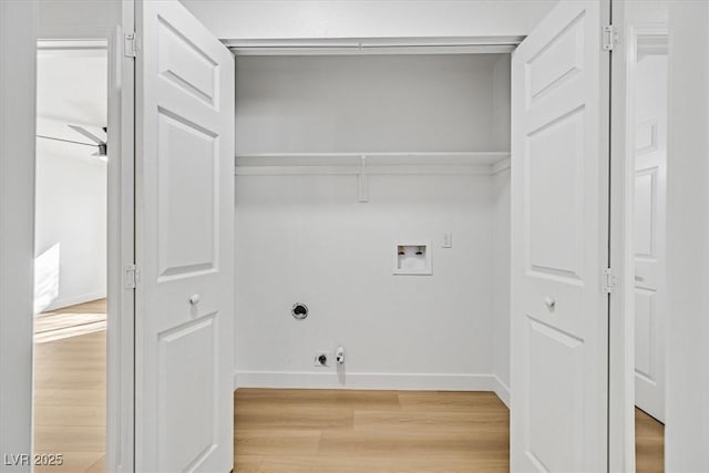 clothes washing area with washer hookup, hookup for an electric dryer, and light hardwood / wood-style floors