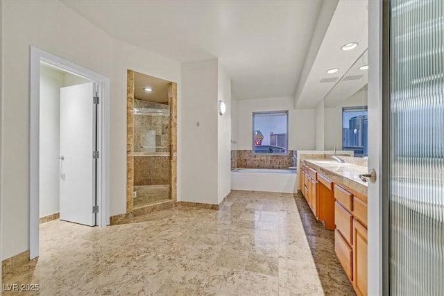 bathroom featuring double vanity, recessed lighting, a sink, a shower stall, and a bath