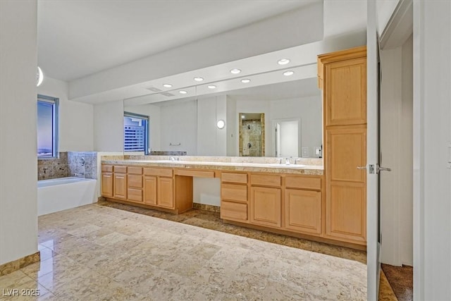 full bathroom featuring a garden tub, recessed lighting, a sink, a shower stall, and double vanity