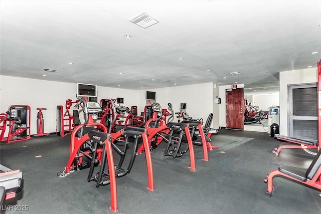 exercise room with visible vents and recessed lighting