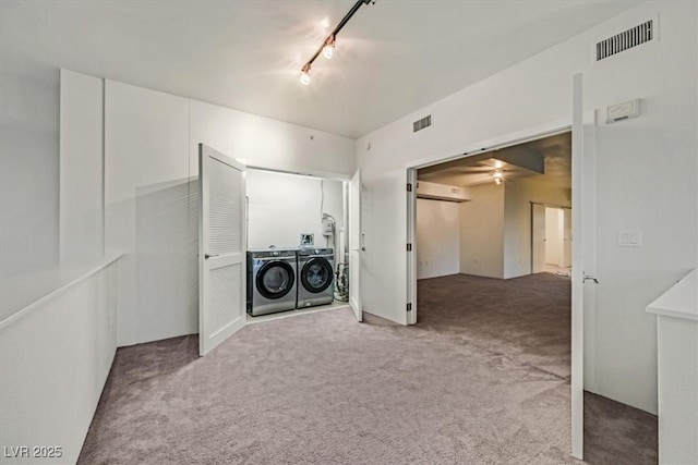 laundry area with carpet floors, laundry area, visible vents, and washer and clothes dryer