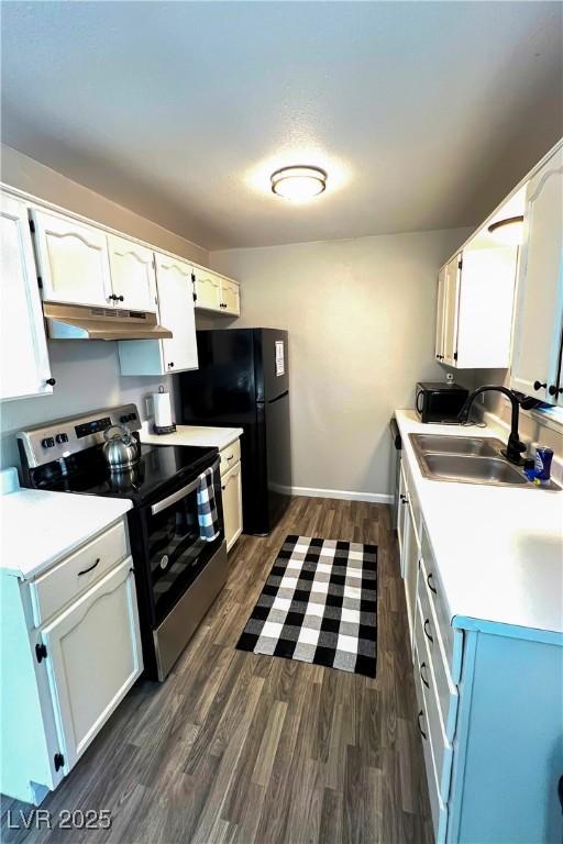 kitchen featuring white cabinetry, sink, and stainless steel electric range