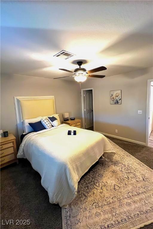 carpeted bedroom featuring ceiling fan