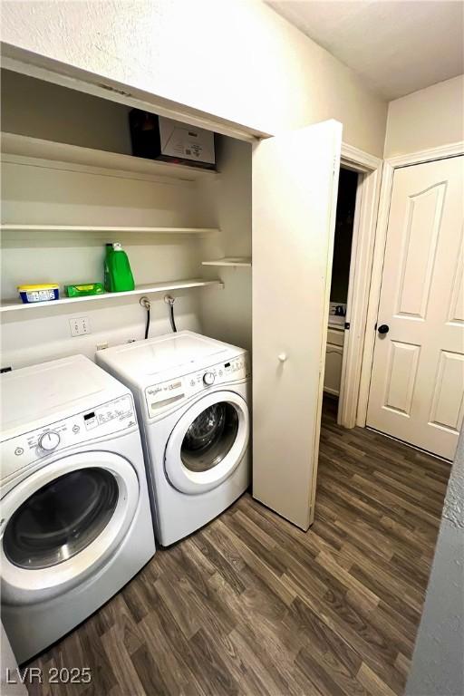 laundry room with dark wood-type flooring and independent washer and dryer