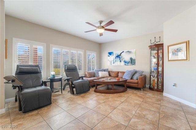 tiled living room with ceiling fan