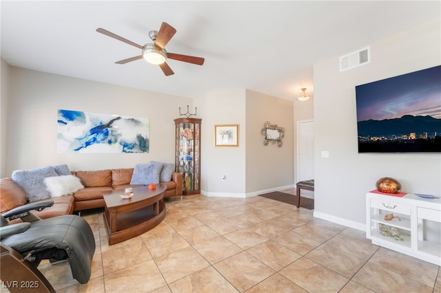 living room featuring light tile patterned floors and ceiling fan