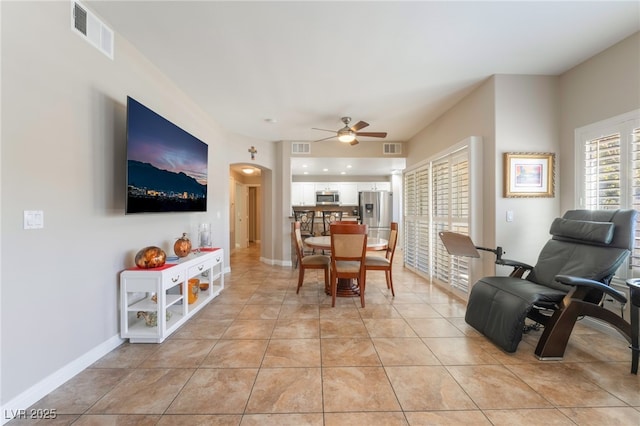 dining room with ceiling fan and light tile patterned floors