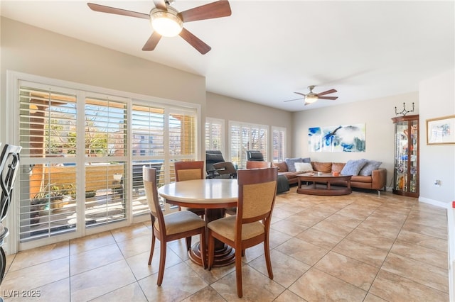 dining room featuring ceiling fan and light tile patterned floors