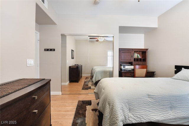 bedroom with a closet and light wood-type flooring