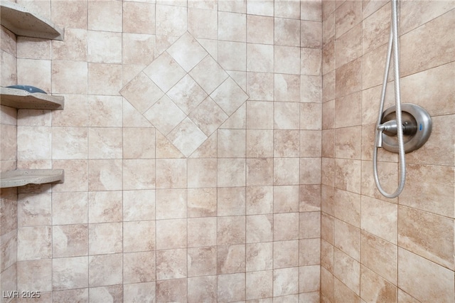 bathroom with tiled shower