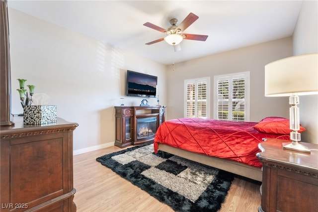 bedroom featuring ceiling fan and light hardwood / wood-style flooring