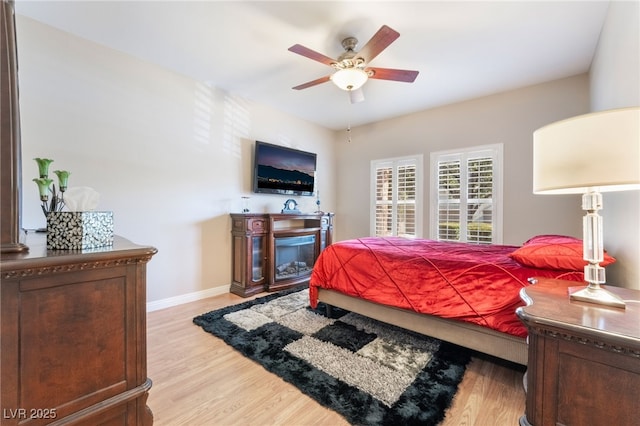 bedroom featuring ceiling fan and light hardwood / wood-style floors