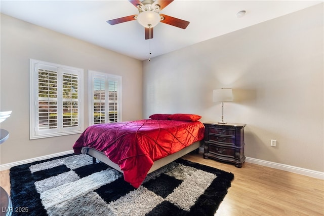 bedroom featuring ceiling fan and light hardwood / wood-style flooring