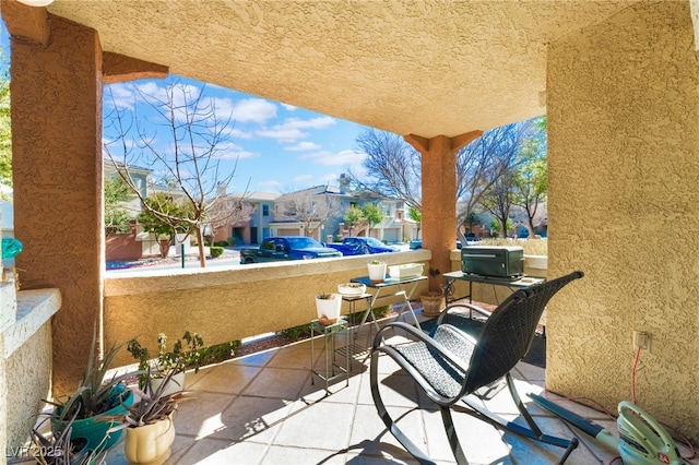 view of patio / terrace with a balcony