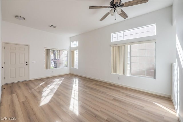 unfurnished room featuring ceiling fan and light hardwood / wood-style flooring