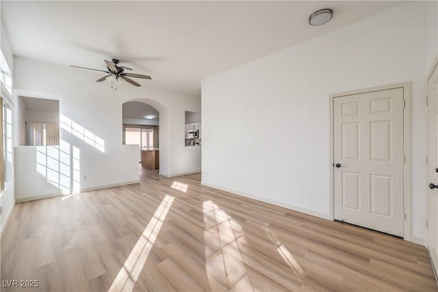 spare room with ceiling fan and light hardwood / wood-style flooring