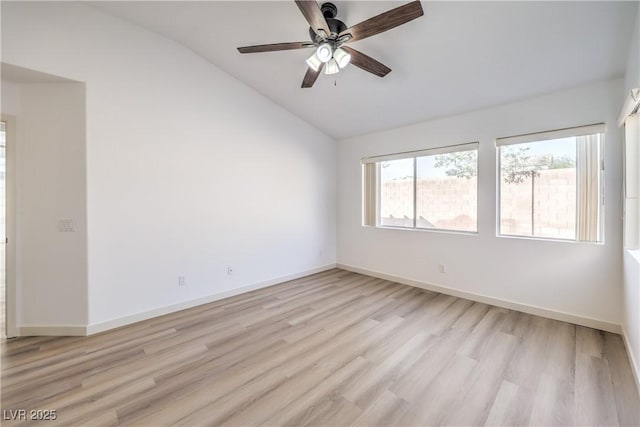 spare room featuring vaulted ceiling, ceiling fan, and light hardwood / wood-style floors