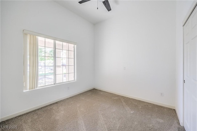 empty room with ceiling fan and carpet floors