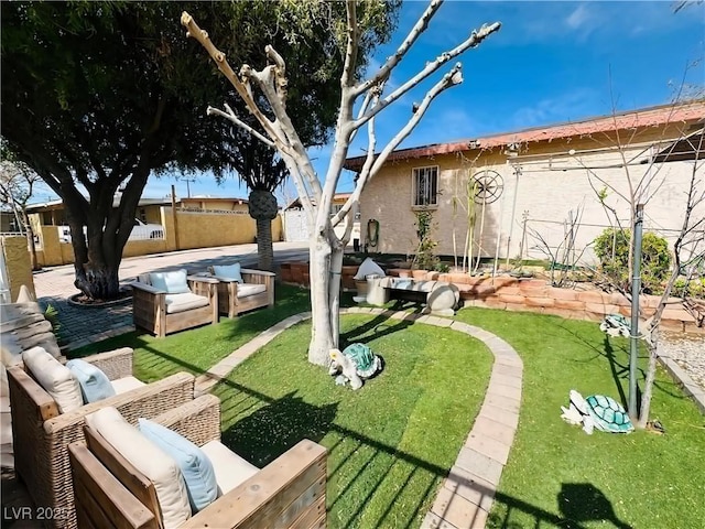 view of yard featuring fence and an outdoor living space