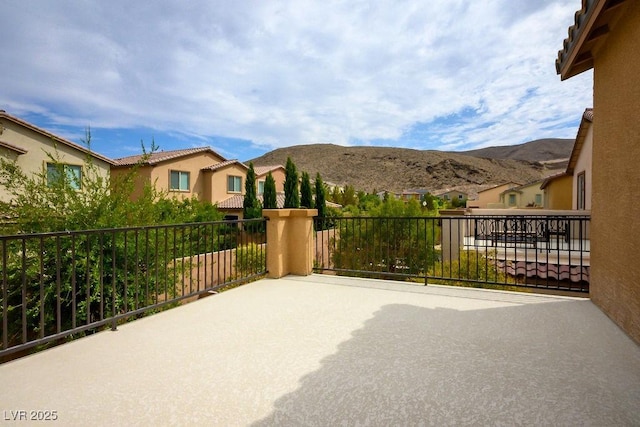 view of patio / terrace featuring a balcony and a mountain view