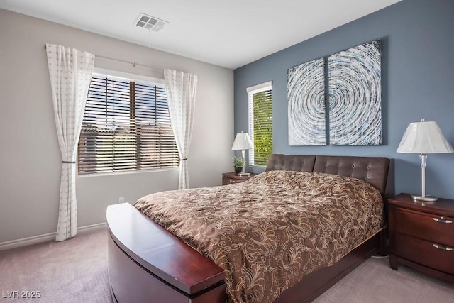 bedroom featuring light carpet