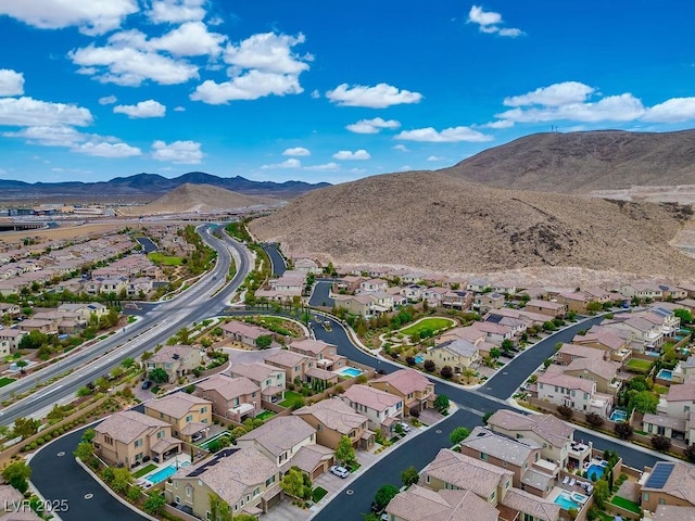 drone / aerial view with a residential view and a mountain view