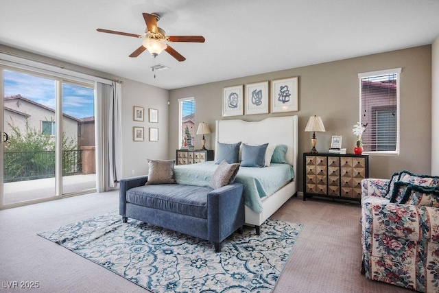 carpeted bedroom with ceiling fan and access to exterior