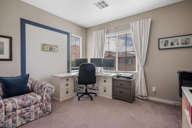 home office featuring light colored carpet, baseboards, and visible vents