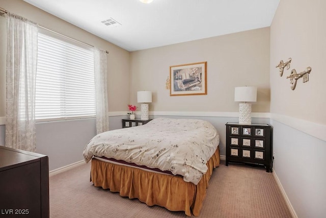 bedroom with light carpet