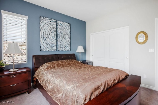 carpeted bedroom with a closet