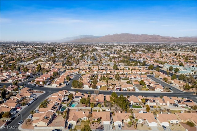 birds eye view of property featuring a mountain view