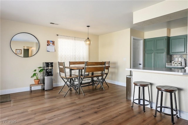 dining space featuring dark hardwood / wood-style flooring