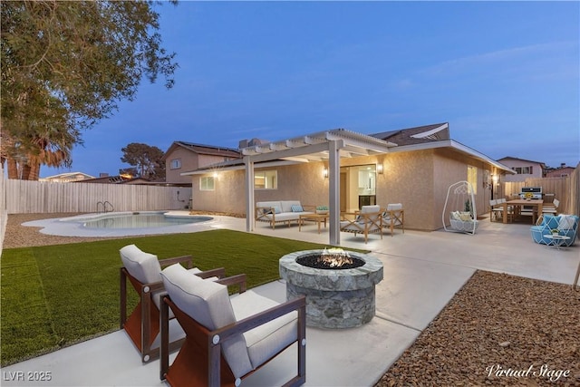 back house at dusk featuring a fenced in pool, a pergola, a yard, a patio area, and an outdoor living space with a fire pit