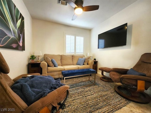 living area with visible vents and a ceiling fan