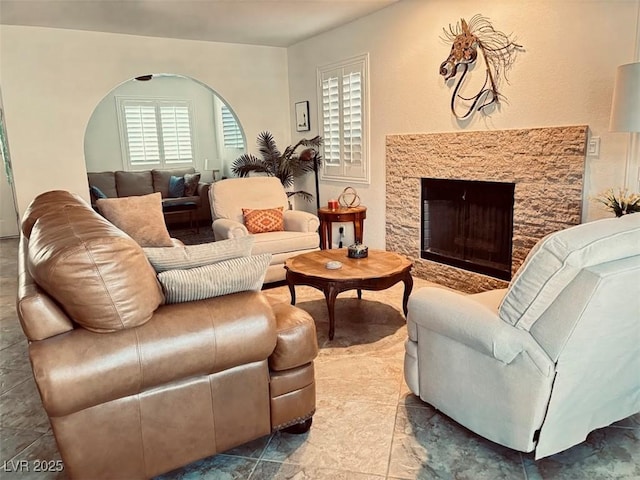 living area featuring a fireplace