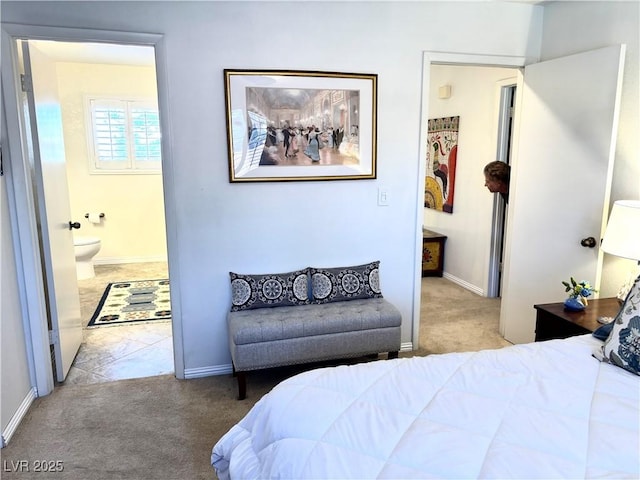 bedroom featuring carpet, connected bathroom, and baseboards