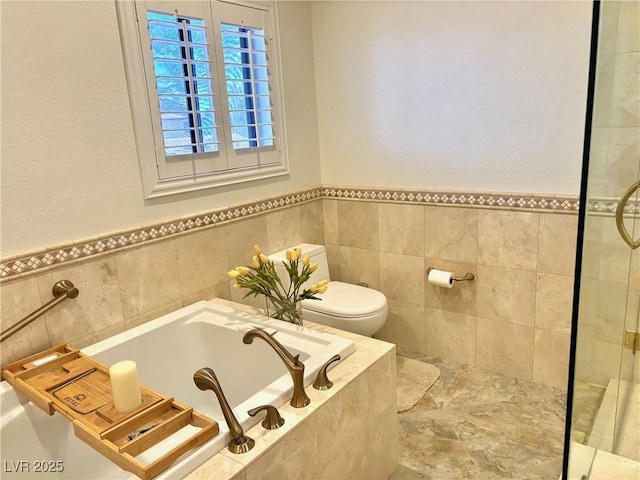 full bath featuring toilet, a garden tub, tile walls, and tiled shower