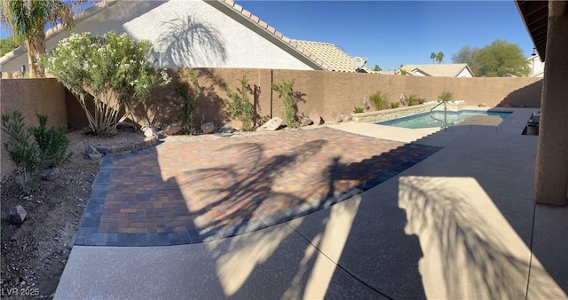 view of patio featuring a fenced in pool