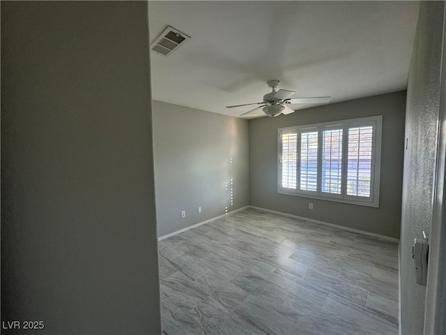 unfurnished room with ceiling fan