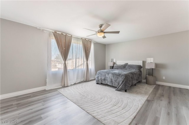 bedroom featuring light hardwood / wood-style flooring and ceiling fan