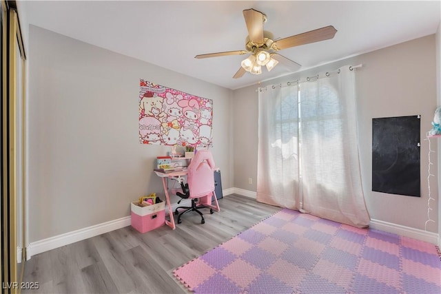 bedroom with ceiling fan and light wood-type flooring