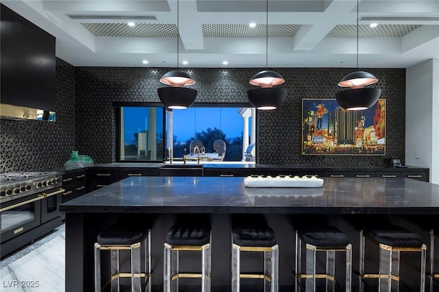 kitchen with backsplash, beamed ceiling, double oven range, exhaust hood, and coffered ceiling