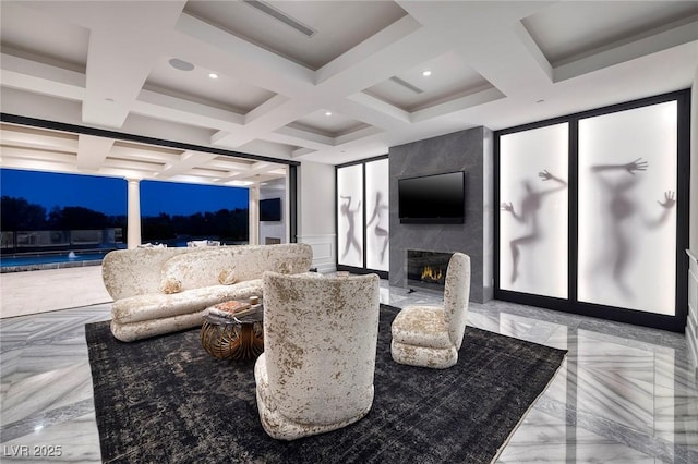 living room featuring a decorative wall, beamed ceiling, a fireplace, and coffered ceiling