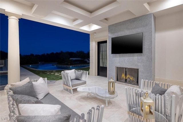 view of patio / terrace featuring an outdoor pool and an outdoor living space with a fireplace