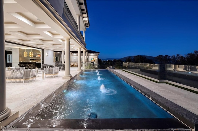 outdoor pool featuring a patio