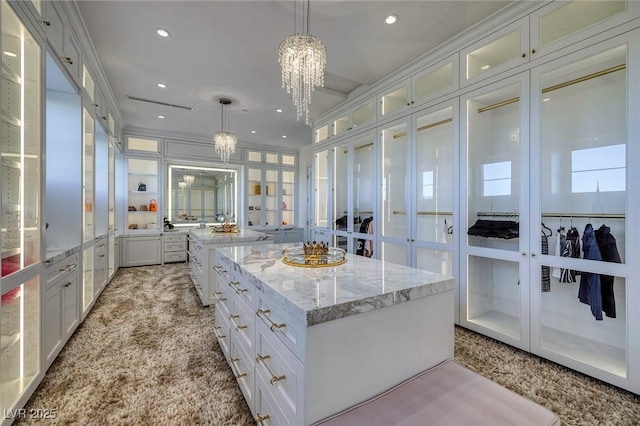 kitchen featuring white cabinets, pendant lighting, and a kitchen island