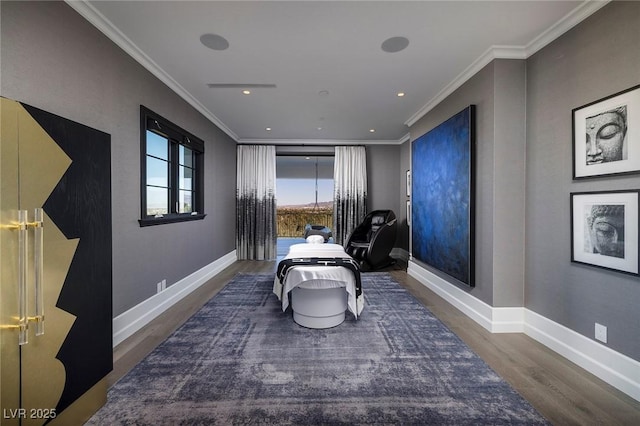 living area with wood finished floors, baseboards, and ornamental molding