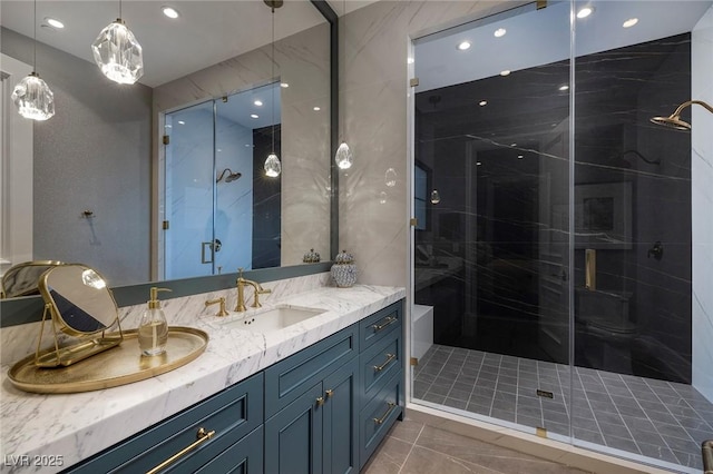 full bathroom with recessed lighting, a stall shower, and vanity