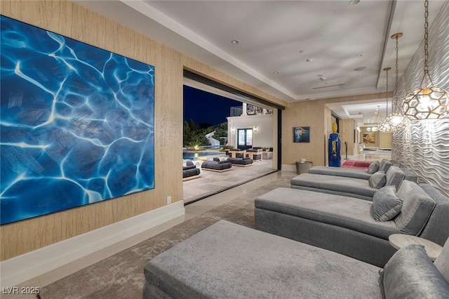 interior space featuring a raised ceiling and an inviting chandelier